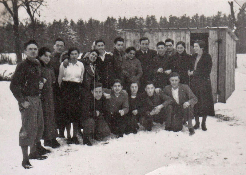 Group with Kurt Wohl in front of the sheds. 7 January 1937.