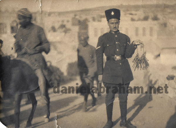 Turkish policeman in Hebron holding keys to Jewish houses.